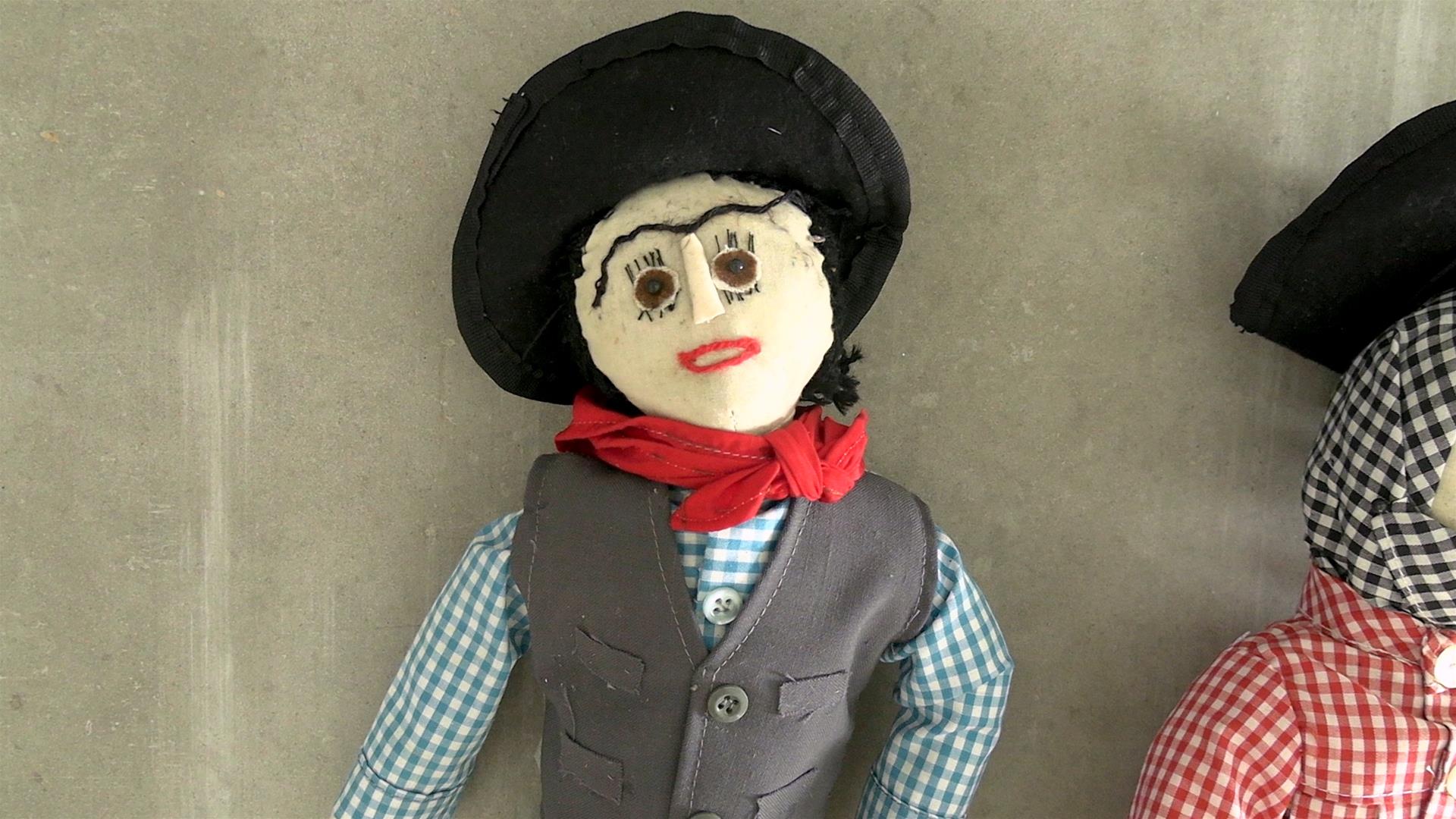 <span><p>Bonecos de pano</p></span>